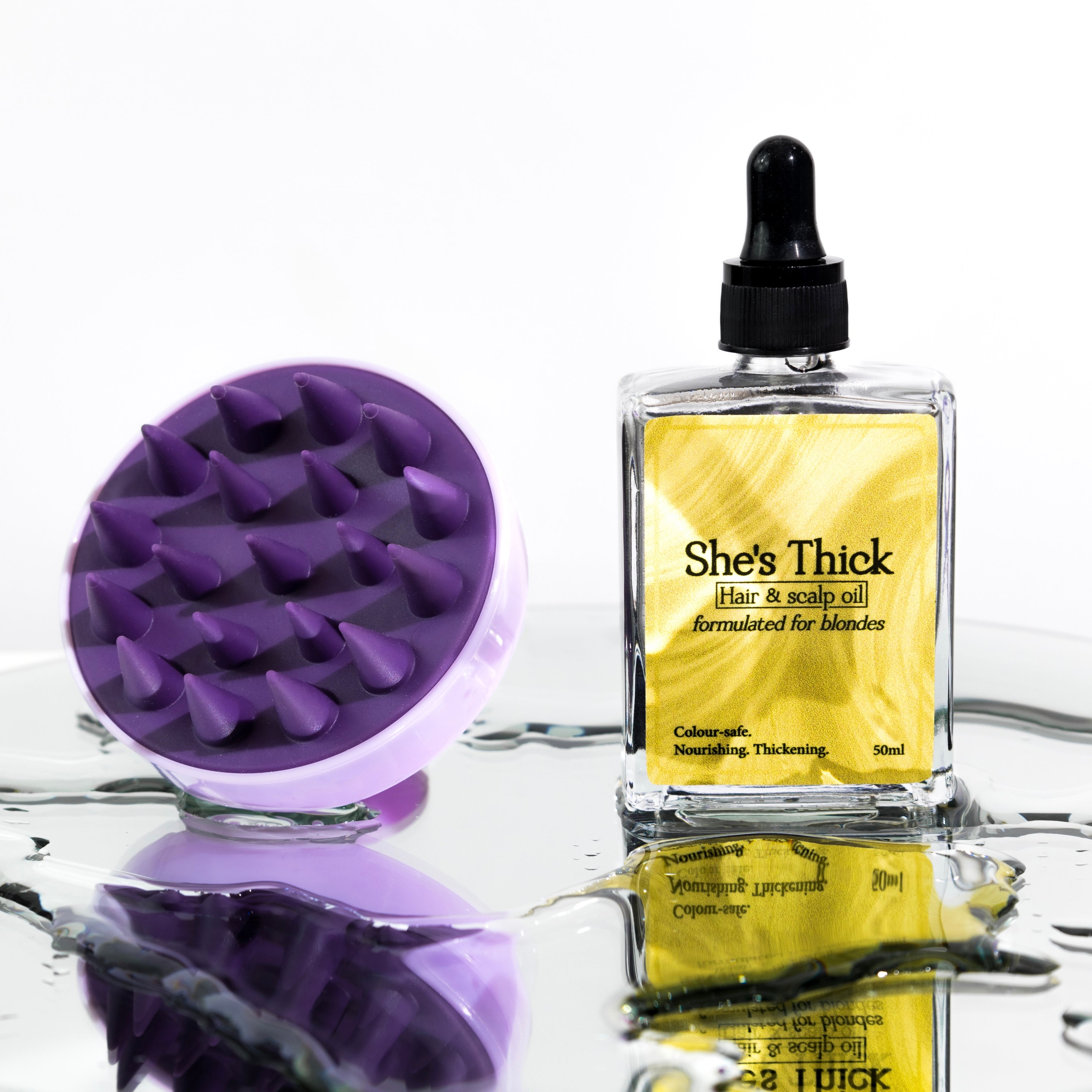 Hair growth and hydrating oil for blonde hair with gentle scalp massager.