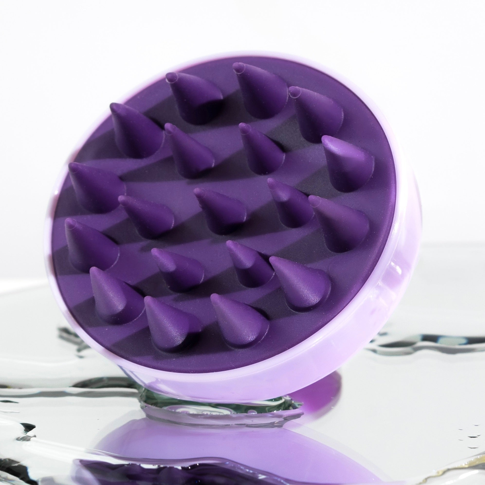 Scalp massager for blonde hair with soft bristles.